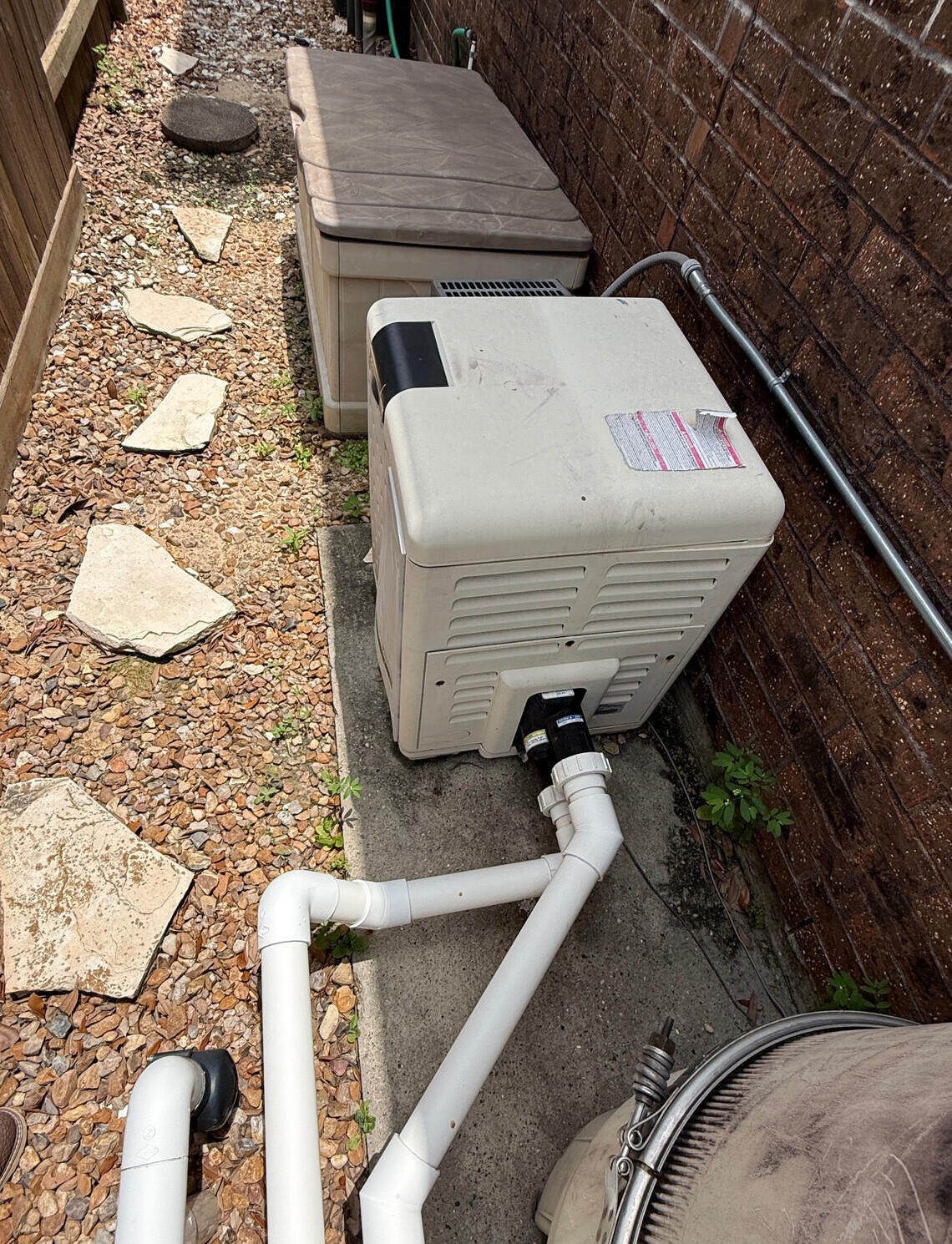 Before picture of a Pentair Mastertemp pool heater install in Katy, Texas, by Drew Pools.